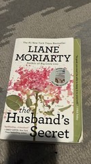 The Husbands Secret- book by Liane Moriarty. Paper back fiction book 445 pages.