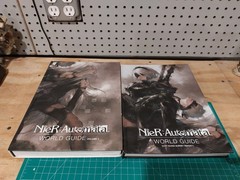 NIER: AUTOMATA WORLD GUIDE VOLUME 1 + 2 By Square Enix – Hardcover Lot